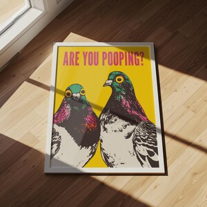 Bright pop art bright yellow poster of two pigeons staring forward,  funny toilet poster or guest bathroom art with text that reads “ARE YOU POOPING?”