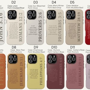 May include: A collection of twelve phone cases in various colors, each featuring a different Bible verse in a vertical layout. The cases are in shades of white, beige, terracotta, yellow, and red. The fonts vary, with the text in black.