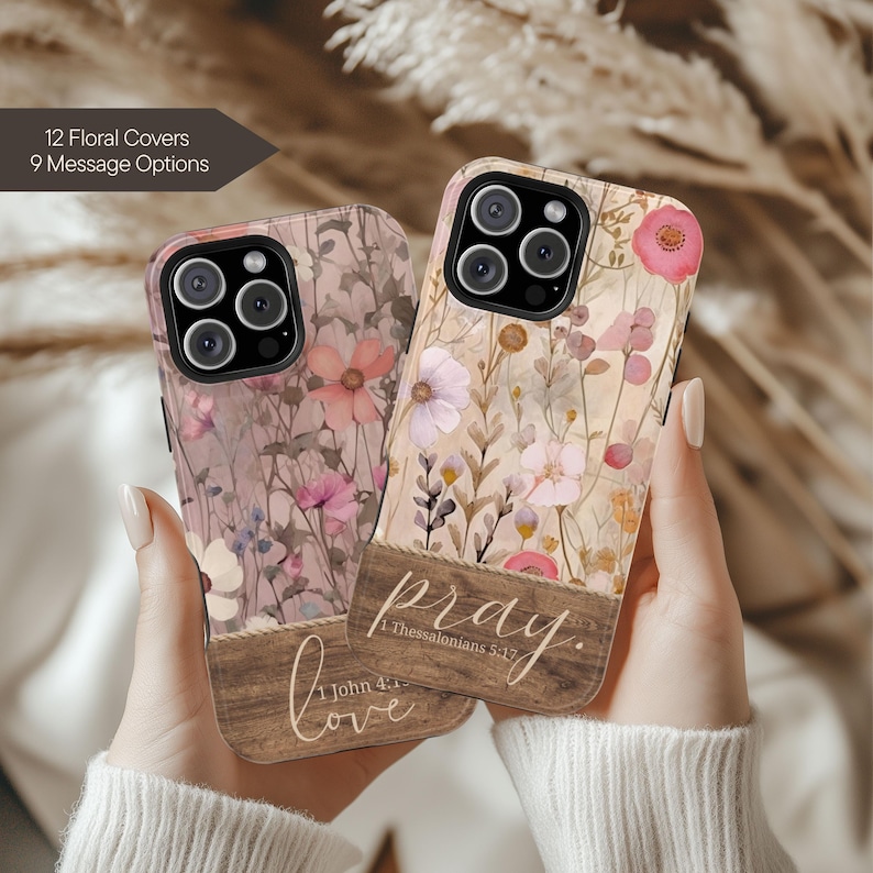 May include: Two floral phone cases with a wooden panel design. One case has the word "love" and the text "1 John 4:1" printed on it. The other case has the word "pray" and the text "1 Thessalonians 5:17" printed on it. The cases have a floral pattern.