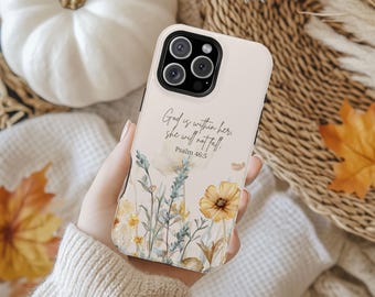 May include: A phone case with a floral design featuring yellow and white flowers and green foliage. The case has the text "God is within her, she will not fall. Psalm 46:5". The case is cream-colored.