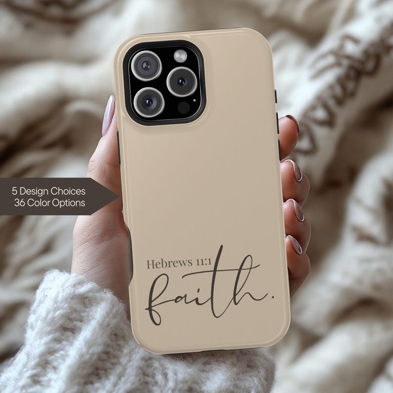 May include: A beige phone case with the word "faith" in a cursive font. The text "Hebrews 11:1" is above the word "faith". The case has a camera and flash. The text "5 Design Choices 36 Color Options" is on the left side.