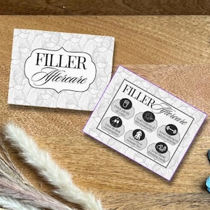 May include: A wooden tray holds two cards with "FILLER Aftercare" text, syringes, vials, and a blue glove. The cards have floral designs. Dried ornamental grasses and stems are also present.