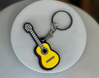 Gele gitaarsleutelhanger: plastic cadeau voor muziekliefhebber