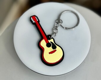 Rubberen gitaarsleutelhanger: kleurrijk cadeau voor muziekliefhebber