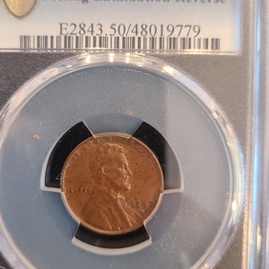 1957-D wheat cent penny with lamination error