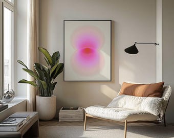 May include: A framed abstract art print with a gradient of pink and red hues. The artwork hangs on a neutral-colored wall above a modern chair with a brown pillow. A large potted plant and a wooden bench with books are in the foreground.