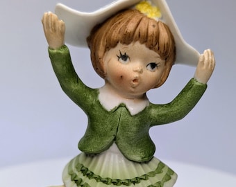 Vintage - Figurine - Girl / Blonde Girl, Green Dress with Log on Head - Porcelain - Marked Taiwan - 4''Tall