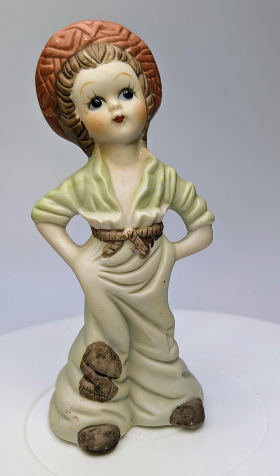 Vintage - Figurine - Girl / Blonde Girl, Green Dress with Log on Head - Porcelain - Marked Taiwan - 6.5''Tall