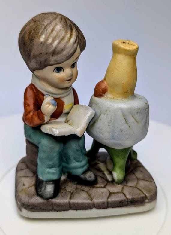 Vintage - figurine - boy with table, vase, book - porcelain - 4'' tall