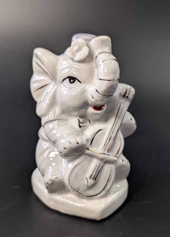 Vintage - Porcelain Elephant Figurine - measures 4''tall