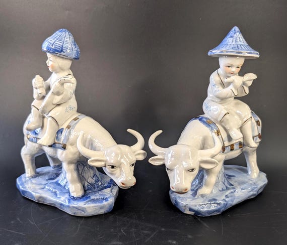 Vintage - Pair of Asian Figurines - Musicians on Buffalo - porcelain - gilding