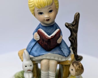 Vintage - Figurine - Girl / Blonde Girl, Blue Dress, Book, Bunny and Doll - Porcelain - 4''Tall