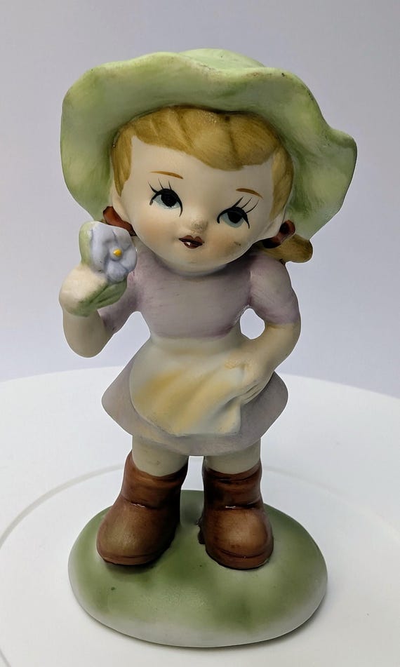Vintage - figurine - Girl / girl in lilac dress, green hat and white flower - porcelain - 4.5'' tall