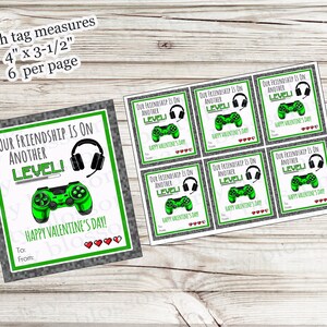 May include: Valentine's Day gift tags with a gaming theme. Each tag measures 4" x 3.5" and features a green game controller, headphones, and the phrase "Our Friendship is on Another Level!" with hearts and the text "Happy Valentine's Day!"