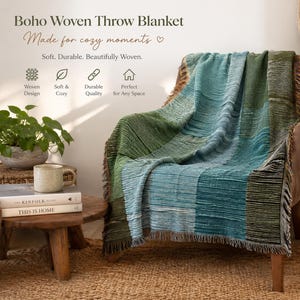 May include: A woven throw blanket featuring a patchwork design in shades of teal, forest green, and olive green. The blanket has a textured surface with fringed edges and is draped over a brown armchair. Text on the image reads Boho Woven Throw Blanket.