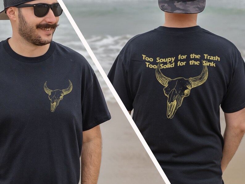 May include: Black t-shirt with a gold bull skull graphic on the front and the text "Too Soupy for the Trash Too Solid for the Sink" with a gold bull skull graphic on the back.