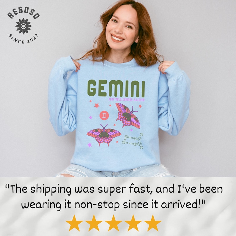 May include: Light blue sweatshirt with a graphic print of a butterfly and the text "GEMINI" in green. The graphic also includes the astrological symbol for Gemini and the text "COMPATIBLE SIGNS: CANCER & LIBRA".