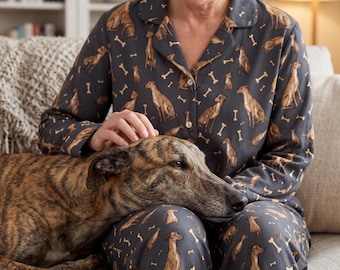 May include: A dark gray long-sleeve button-down pajama shirt and matching pants set featuring an all-over print of brown greyhound dogs in various sitting positions interspersed with small light-colored bone shapes throughout the fabric.