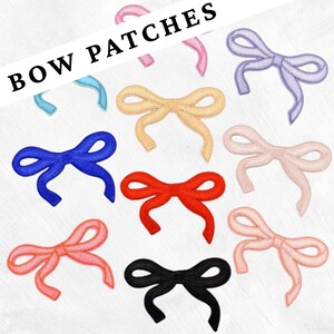 May include: A selection of colourful bow patches in shades of blue, pink, yellow, red, and black. The text "BOW PATCHES" is displayed in a bold, black font across the top of the image. These patches are suitable for adding a decorative touch to clothing or accessories.