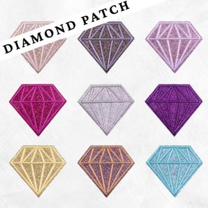 May include: Nine diamond-shaped patches in various colors, including pink, purple, silver, gold, and blue. Each patch has a glittery interior and a stitched outline. The text "DIAMOND PATCH" is displayed at the top.