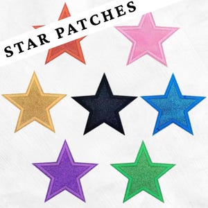May include: A collection of seven star-shaped patches in various colors, including red, pink, gold, black, blue, purple, and green. The patches have a glittery texture and are arranged on a white background. The text "STAR PATCHES" is displayed across the top.