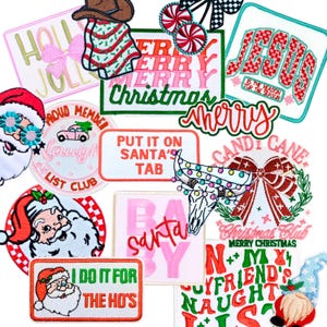 May include: A selection of embroidered Christmas patches in various shapes. The patches feature festive designs, including Santa Claus, candy canes, bows, and text like "Merry Christmas" and "I do it for the ho's".