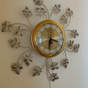 Vintage “Corona Clock”.  MCM—with a vine motif.  Essentially brand new. Mid 50s. Made by United Clock Co.