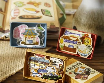 Japanese Matchbox Stickers! 50 cute stickers in each box, 4 themes to choose from. Comes with a FREE kawaii stationery gift, and candy!