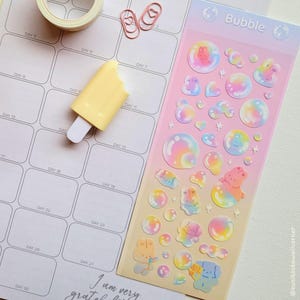 May include: A set of three ceramic mugs with a speckled, matte finish. The mugs are in shades of cream, light gray, and dark gray. Each mug has a simple, minimalist design, perfect for coffee or tea.