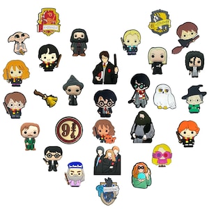 May include: A collection of colorful, cartoon-style charms featuring characters and symbols from the Harry Potter series. The charms include figures of Harry, Hermione, Ron, Dumbledore, and other characters, as well as house crests and a broom.