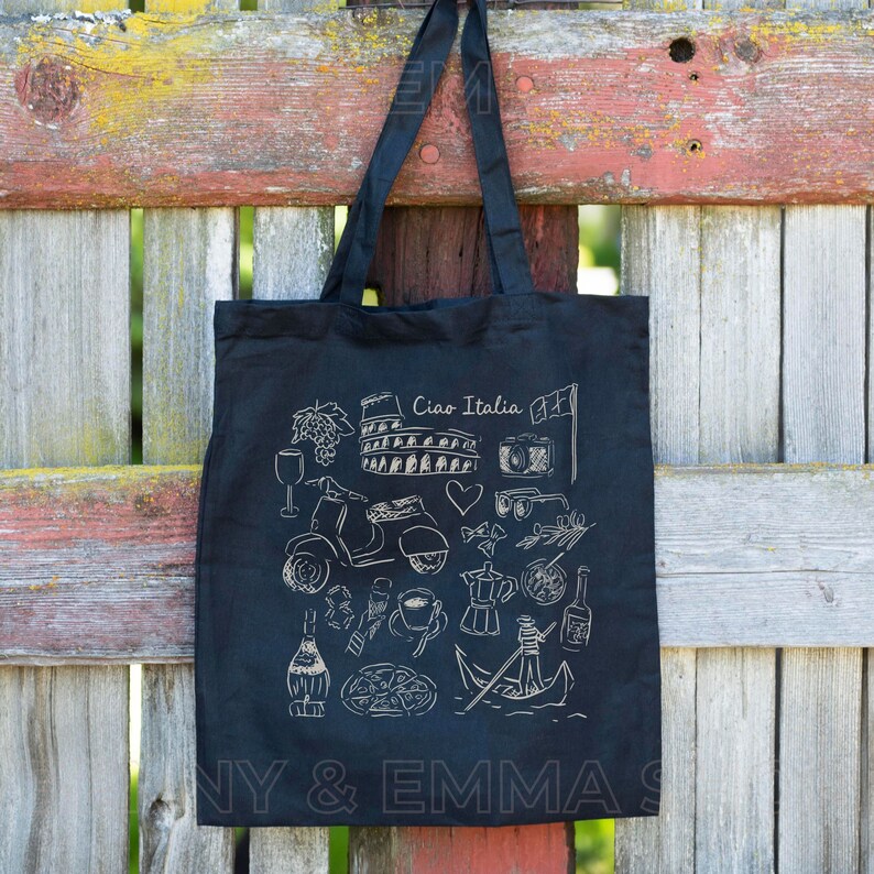 May include: Black tote bag with white illustrations of Italian landmarks, food, and culture. The text "Ciao Italia" is printed on the bag.
