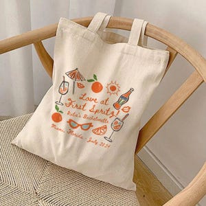 Love At First Spritz Aperol Spritz Bachelorette Tote Bag Italy Girls Trip Bridesmaid Proposal Coastal Granddaughter Foldable Canvas Totebag