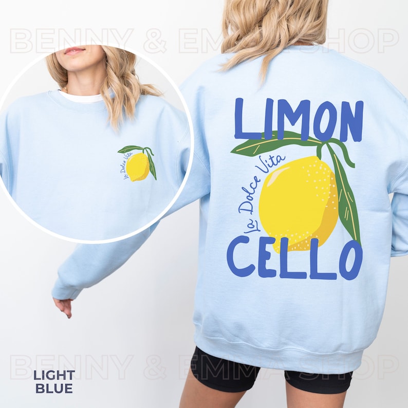 May include: Light blue sweatshirt with a lemon graphic and the text "LIMON La Dolce Vita CELLO" printed on the back.