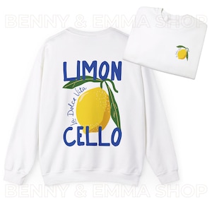 May include: White sweatshirt with a blue and yellow lemon graphic and the text "Limon Cello La Dolce Vita".
