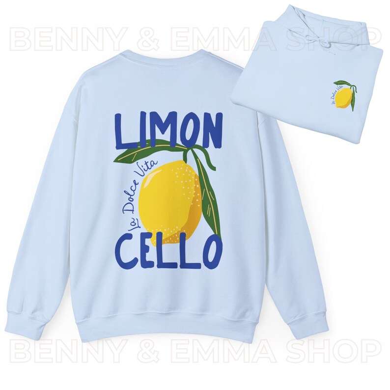 May include: Light blue sweatshirt with a lemon graphic and the text "Limoncello La Dolce Vita" in blue lettering.