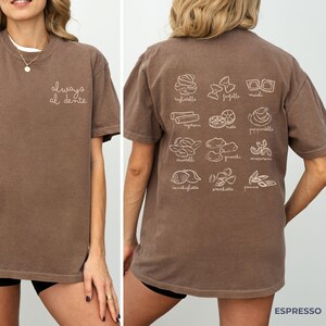 May include: Brown t-shirt with the text "always al dente" on the front and illustrations of different types of pasta with their names on the back.