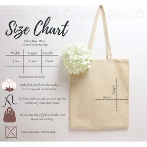May include: A beige cotton canvas tote bag with a size chart showing the width, length, and handle measurements in inches. The tote bag has self-fabric handles with reinforced stitching. The text "Liberty Bags OAD13 Cotton Canvas Tote Bag" is printed on the bag.