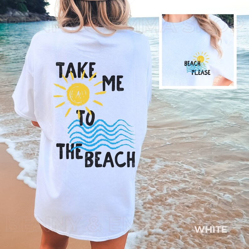May include: White t-shirt with a graphic print of a sun, waves, and the text "Take me to the beach".