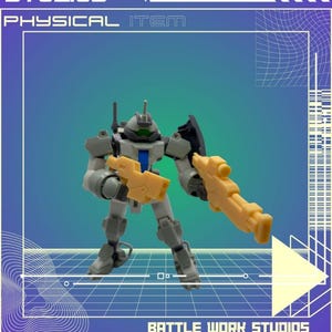May include: A gray and yellow robot action figure with a green visor and two yellow blasters. The figure is posed against a blue and purple gradient background with the text "BATTLE WORK STUDIOS" and "PHYSICAL ITEM".