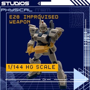 May include: A model robot in white and blue with yellow weapon attachments. The image includes the text "BATTLE WORK STUDIOS", "PHYSICAL ITEM", "E28 IMPROVISED WEAPON", and "1/144 HG SCALE". The robot has the number "81" on its leg.