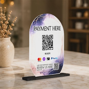 May include: An arched acrylic payment sign featuring a watercolour design in shades of purple and pink with gold geometric lines. It displays the text PAYMENT HERE, a large QR code, payment icons, and a smaller QR code with the text REVIEW US HERE.