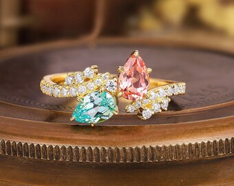 ペアカットのピンクサファイアとブルートルマリンのリング：ツートン