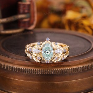 Vintage oval green moissanite engagement ring set 14k gold engagement ring set Unique natural sapphire leaf ring set Bridal wedding set ring image 1