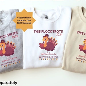 May include: Three sweatshirts in grey, white, and beige, each with a turkey graphic and the text "THIS FLOCK TROTS 2024". The design includes the text "Johnson Family Springfield 5K Trot".