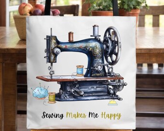 May include: A white tote bag with a black handle features a vintage sewing machine illustration with the text "Sewing Makes Me Happy".
