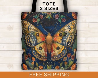 May include: A tote bag featuring a colorful butterfly with intricate details against a dark blue background with stars and flowers. The butterfly has a yellow, orange, and red body with blue and white wings. The text "TOTE 3 SIZES" is printed at the top of the bag.