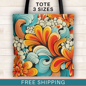 May include: A colorful tote bag with a swirling floral pattern in shades of orange, blue, and yellow. The bag has black handles and the text "TOTE 3 SIZES" is printed on the top.