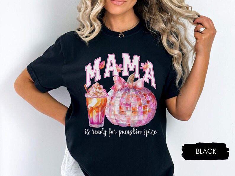 May include: Black t-shirt with a pink and white graphic of a pumpkin, a fall-themed drink, and the text "MAMA is ready for pumpkin spice".