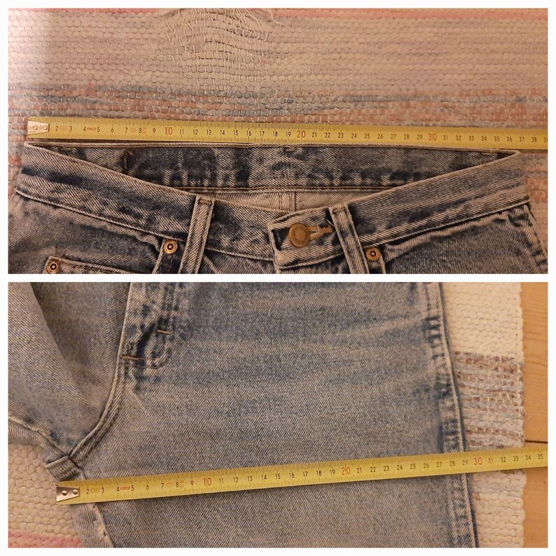 May include: Light blue denim jeans with a button closure and a metal rivet. A yellow measuring tape shows the waist and leg measurements. The jeans are laid flat on a patterned surface.