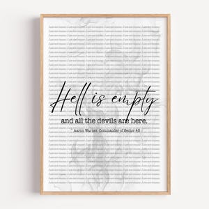 May include: A framed print with a light wood frame. The print has a white background with a repeating text pattern. The words "Hell is empty and all the devils are here" are written in cursive. The author is Aaron Warner.